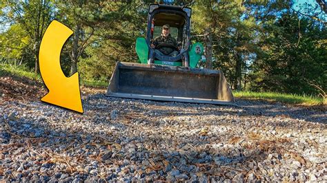 how to level a gravel driveway with a skid steer|Leveling out a Gravel Driveway using a Skid Steer Land.